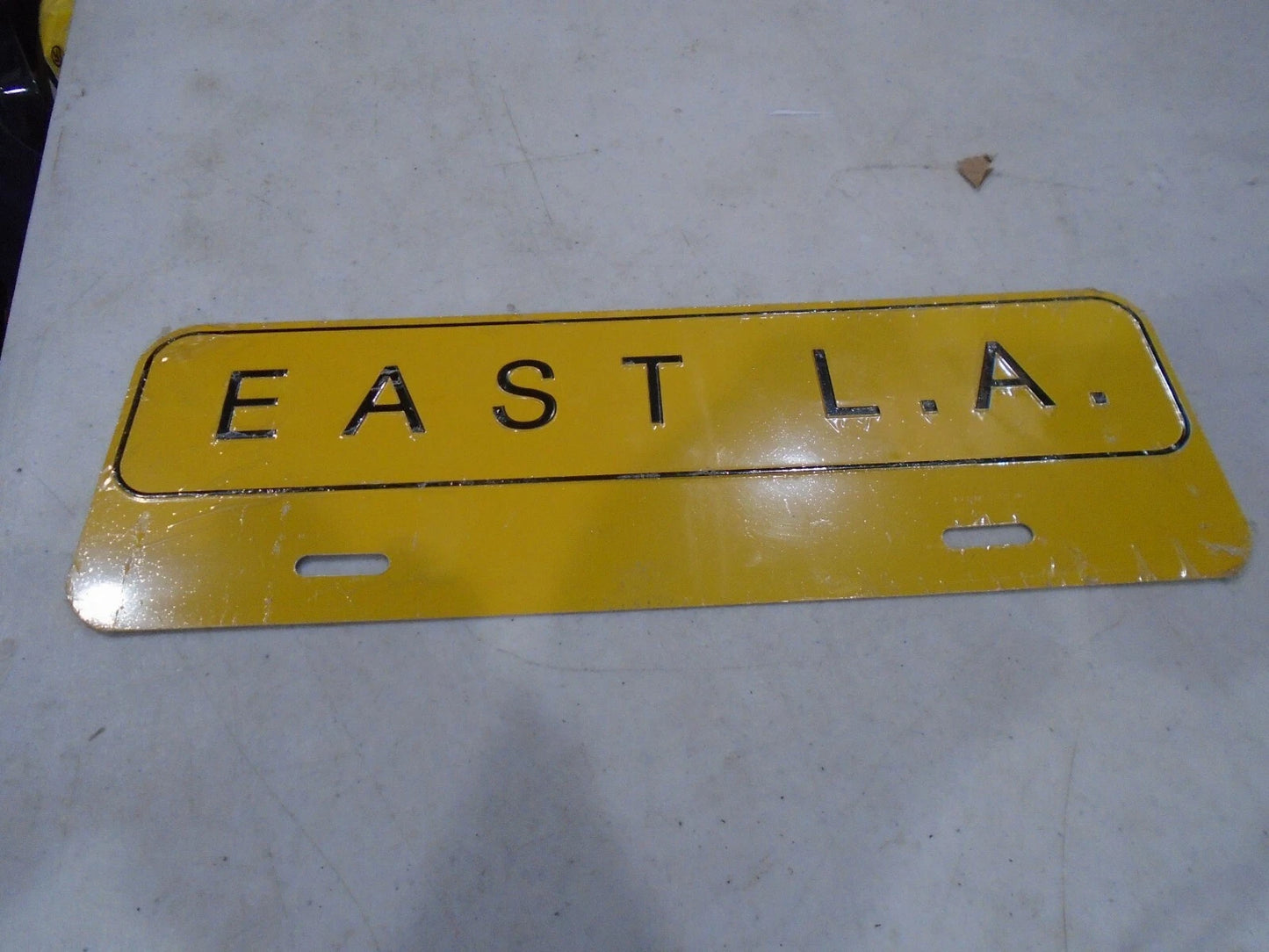 EAST LA LICENSE PLATE TOPPER  METAL EMBOSSED.