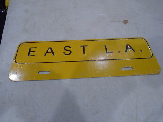 EAST LA LICENSE PLATE TOPPER  METAL EMBOSSED.